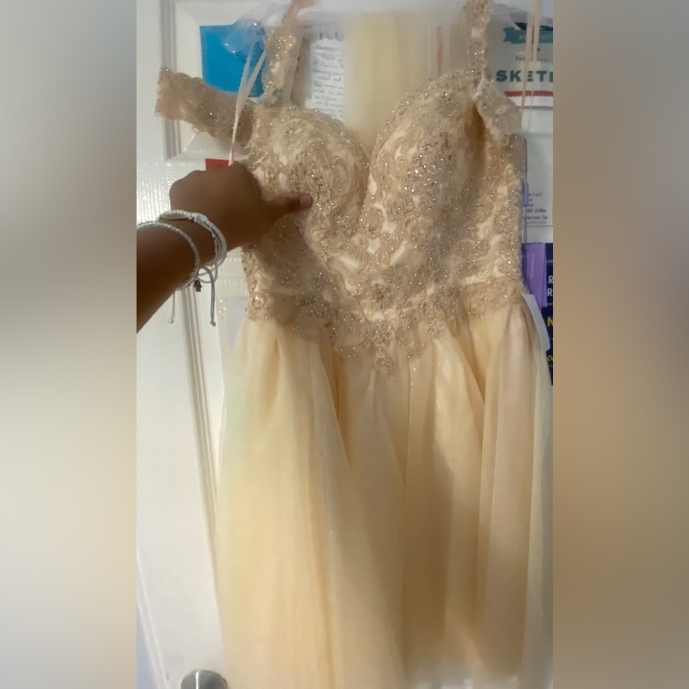 Very light brown dress with gems